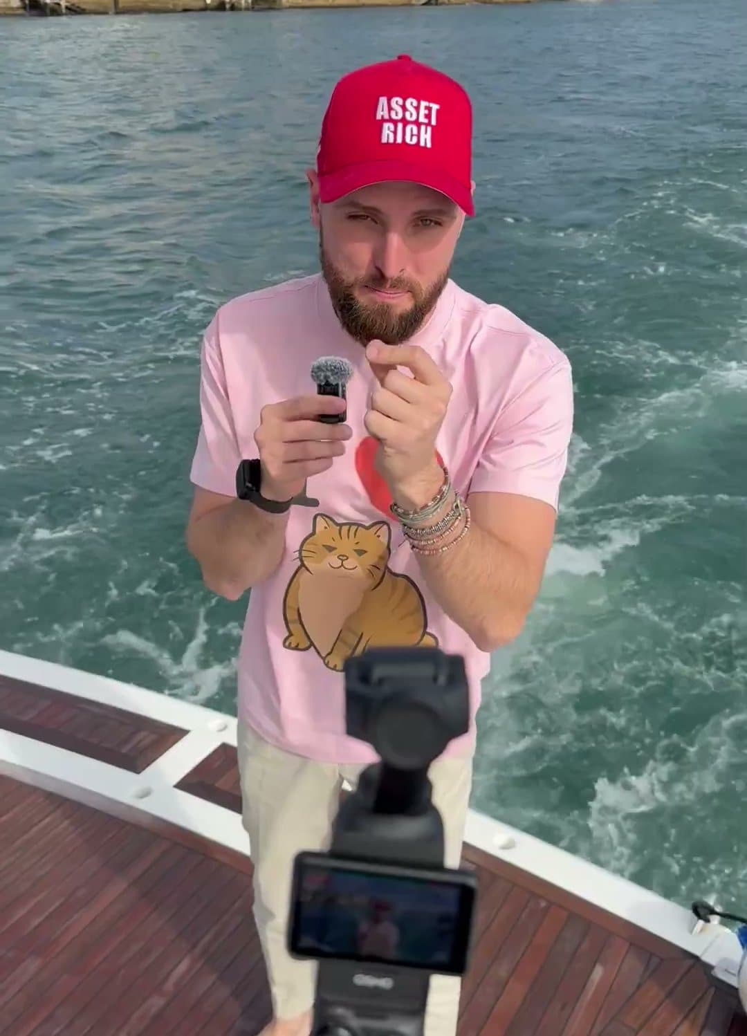A founder filming a selfie video on a pocket camera