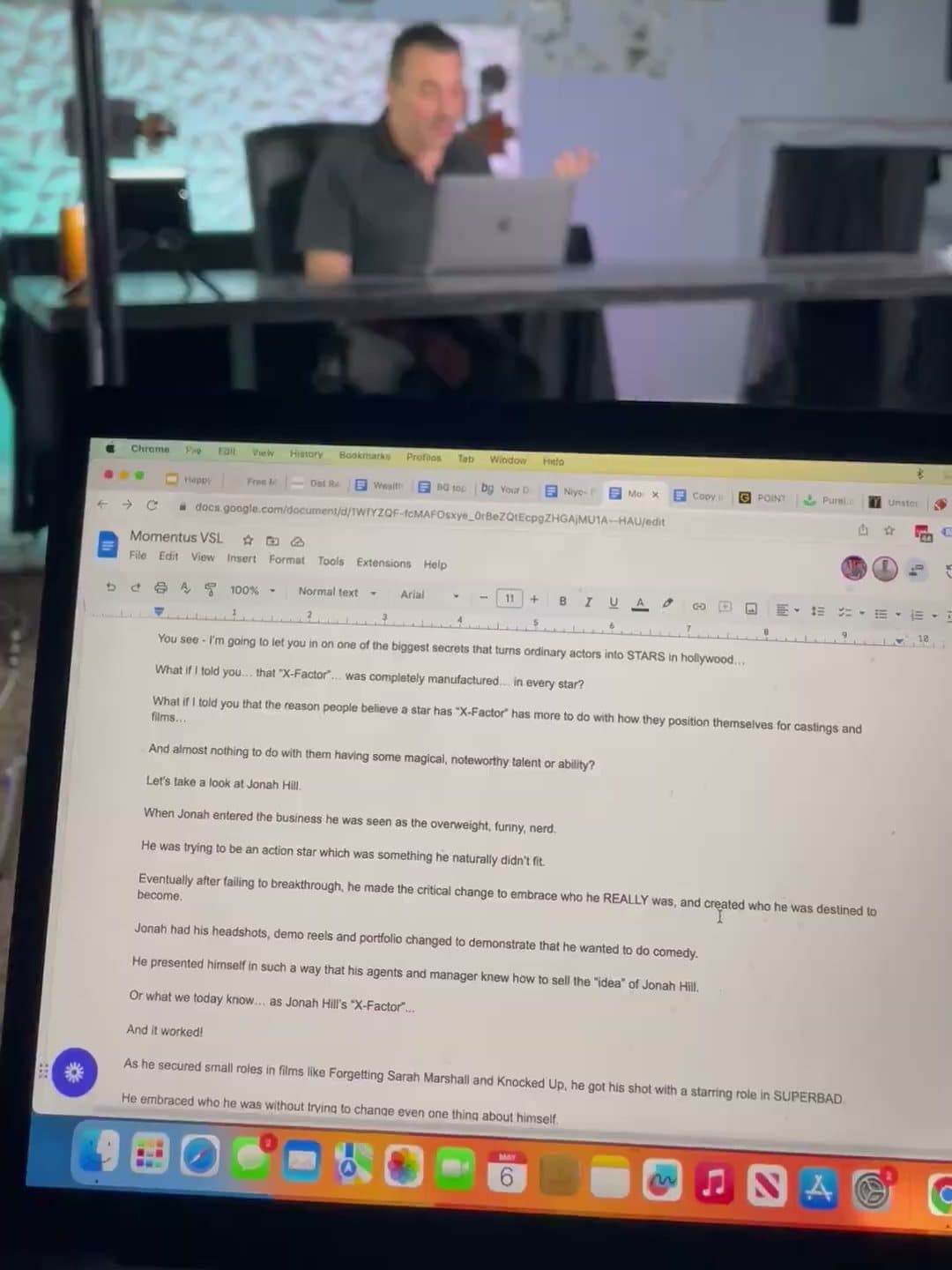 An ad script open on a laptop while the founder films it